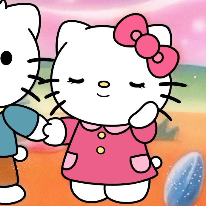 Có hai hello kitty đứng cạnh nhau trên bãi biển