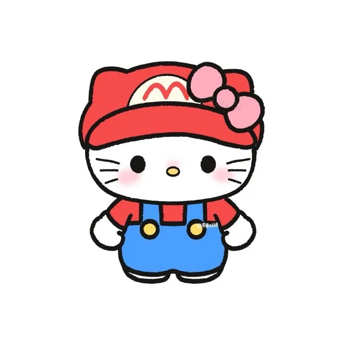 Có một chú mèo con mặc áo liền quần và mũ đỏ