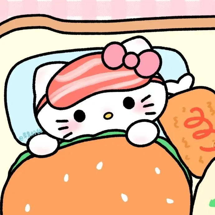 Có một chú mèo con nằm trên giường với chiếc bánh hamburger