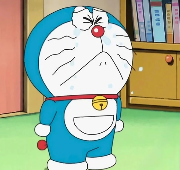 một nhân vật hoạt hình trong một căn phòng có tủ sách crying meme