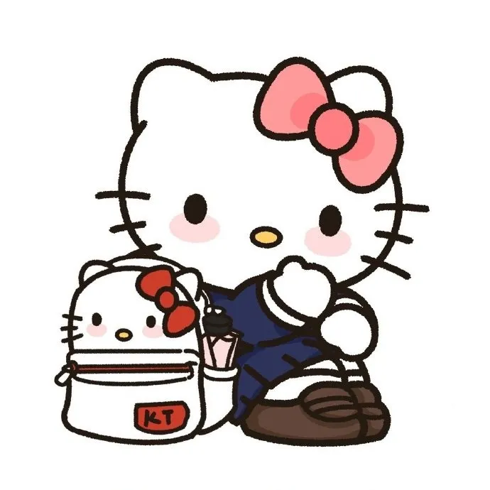 Có một chú mèo con với chiếc ba lô ngồi cạnh nó