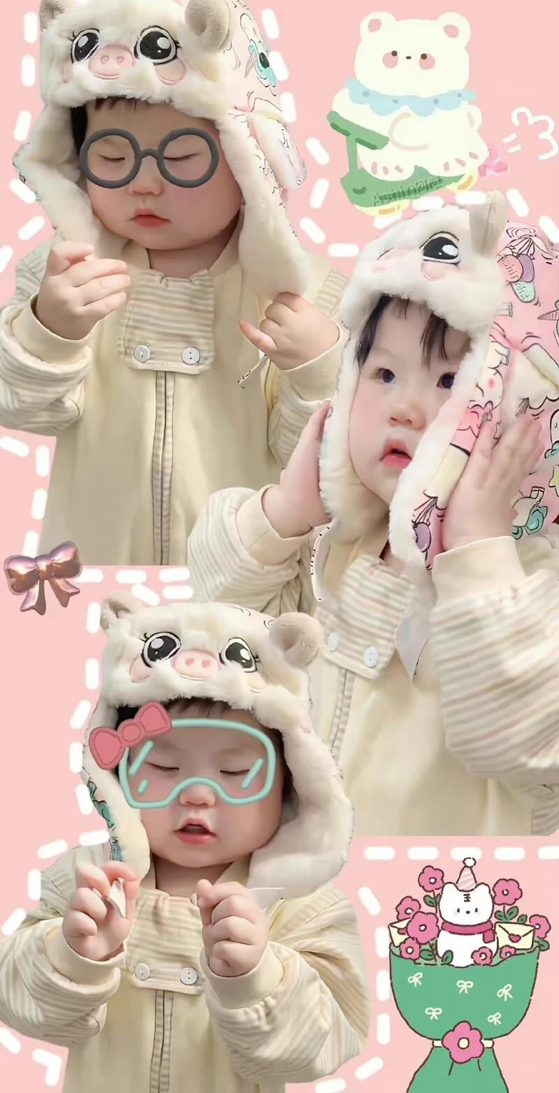 Một em bé mặc áo khoác trắng và mũ hồng hình nền em bé cute