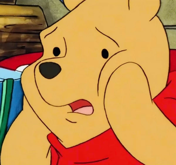 Một nhân vật hoạt hình đang ngồi trên giường meme bất ngờ