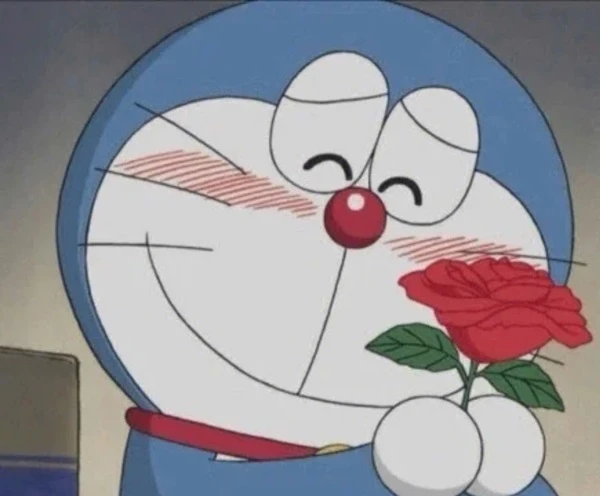 Một nhân vật hoạt hình cầm một bông hồng trong tay meme doraemon