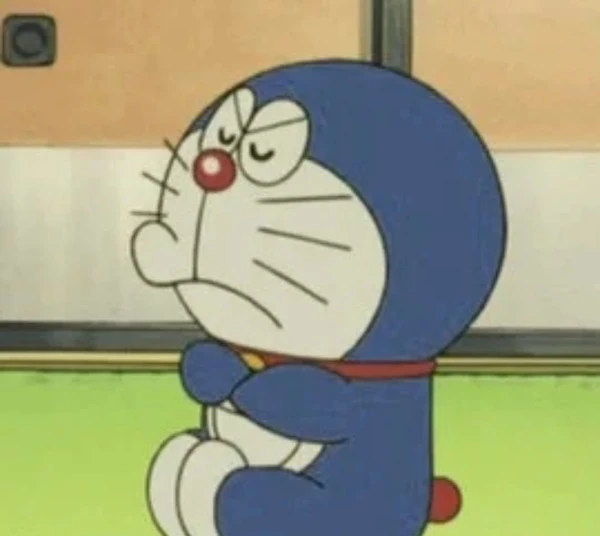 một nhân vật hoạt hình trong bộ đồ màu xanh meme doraemon