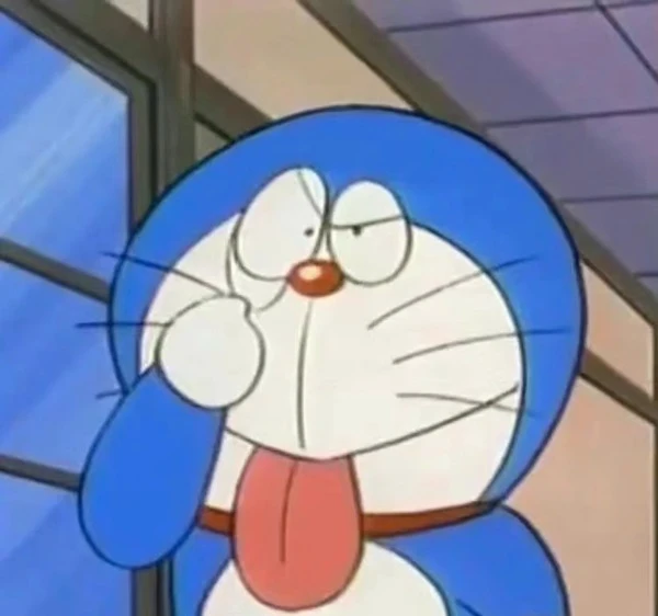 Một nhân vật hoạt hình với cà vạt đỏ và áo sơ mi màu xanh meme doraemon