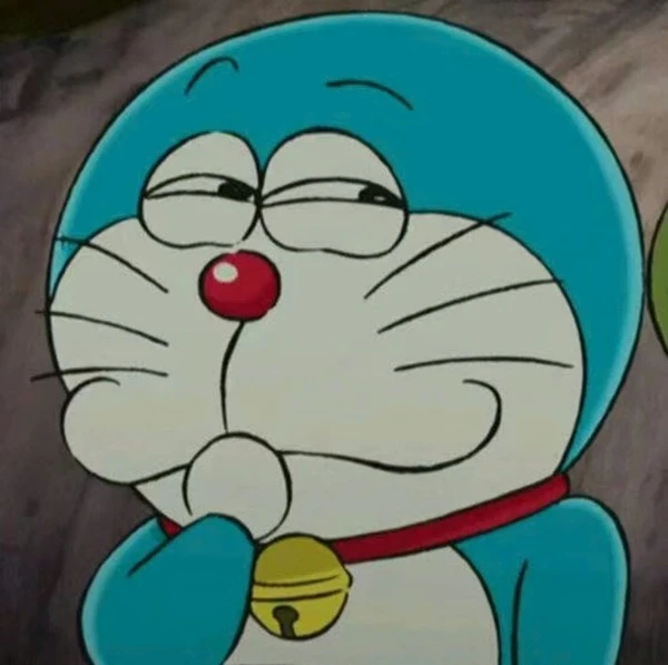 một nhân vật hoạt hình với chiếc mũ màu xanh và mũi đỏ meme doraemon