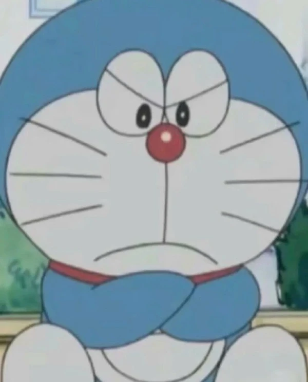 một nhân vật hoạt hình với khuôn mặt màu xanh và khuôn mặt trắng meme doraemon