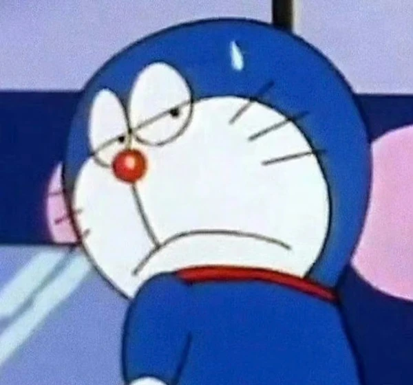một nhân vật hoạt hình với khuôn mặt màu xanh và mũi đỏ meme doraemon