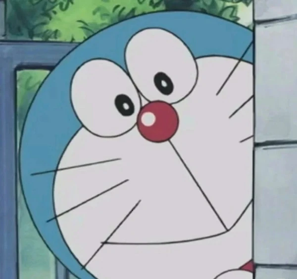 một nhân vật hoạt hình với khuôn mặt màu xanh và trắng meme doraemon