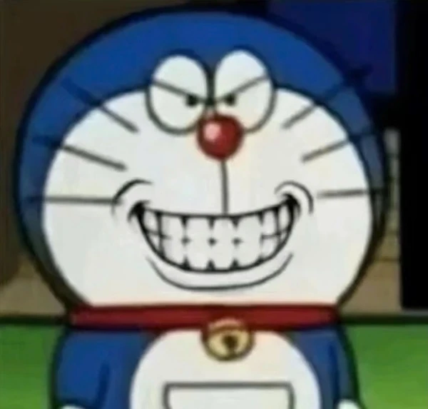 Một nhân vật hoạt hình với một nụ cười lớn meme doraemon