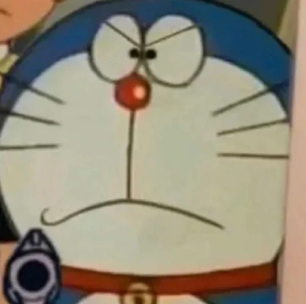 một nhân vật hoạt hình với mũi đỏ và áo sơ mi màu xanh meme doraemon
