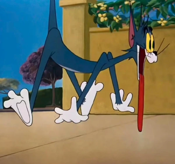Hình nền meme tom and jerry: Một con mèo hoạt hình đang đứng trên tiếng sau của nó