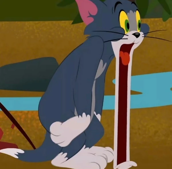 Một con mèo hoạt hình ngồi trên mặt đất bên cạnh một chiếc ô màu đỏ - meme tom and jerry