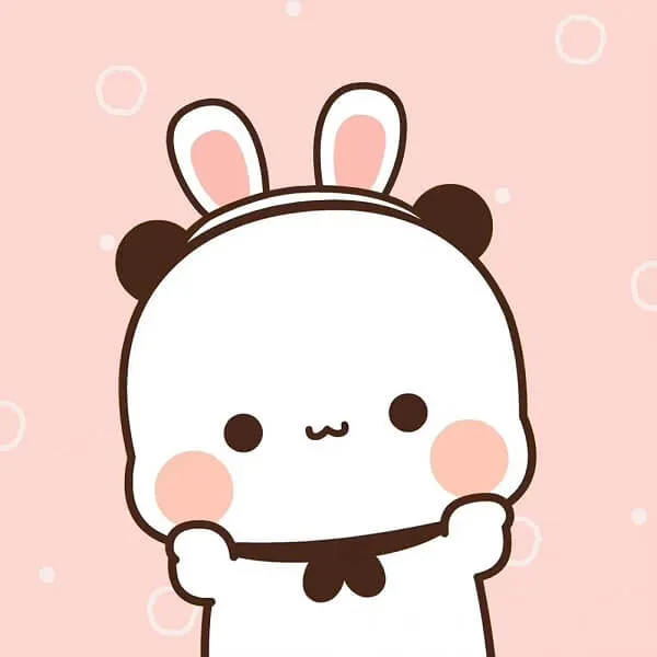 Có một con thỏ trắng đang đứng lên với cánh tay của nó